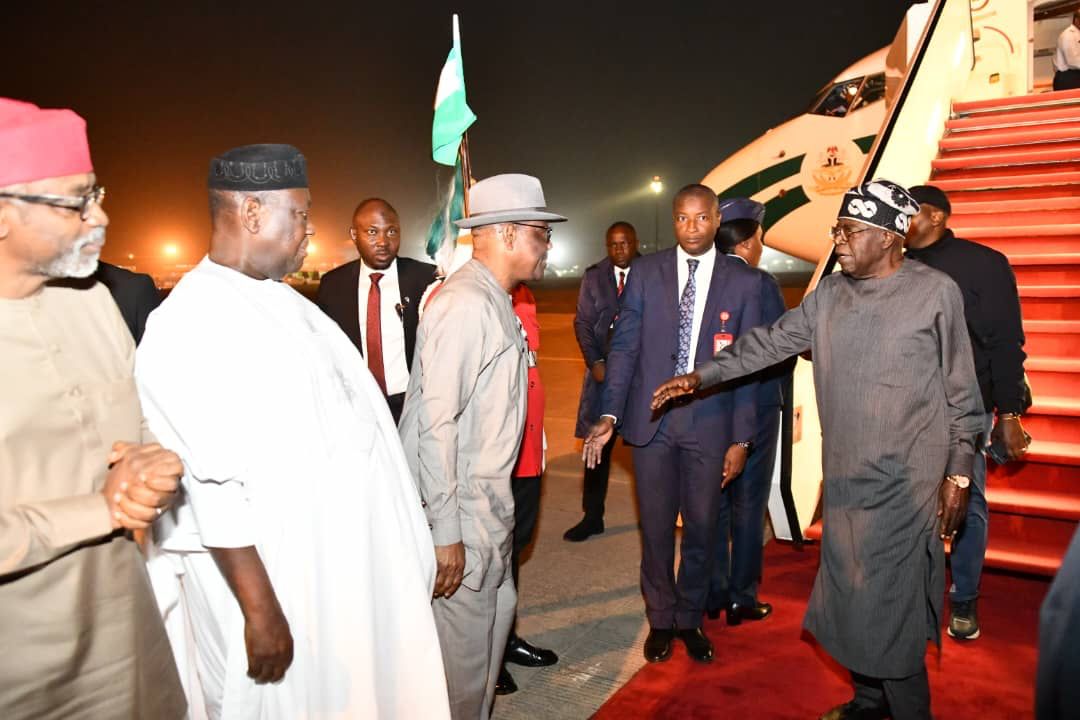 Tinubu returns from France