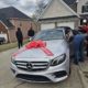 (PHOTOS) US-based Nigerian nurse gifts her husband who brought her to America Mercedes Benz on 50th birthday.