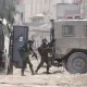 The Israeli military - pictured here on Wednesday - has conducted raids in a number of West Bank cities over the past two days