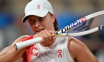 Swiatek survives body blow to reach Olympic semi-finals