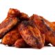 A school worker has been jailed for nine years after stealing $1.5m (£1.18m) worth of chicken wings. Vera Liddell's year-long heist of the