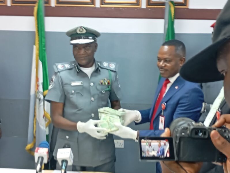 Applauds as Customs hand over seized foreign currency to EFCC