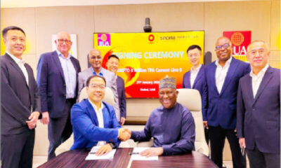 Chairman CBMI Construction Ltd., Zhang Sicai, in a handshake with the chairman, BUA Cement Plc, Abdul Samad Rabiu (sitting), flanked from left to right by: CBMI deputy director of Marketing, Zhang Wanjun; chief operations officer, BUA Cement Plc, Finn Arnoldsen; managing director, BUA Cement Plc. Yusuf Binji; assistant general manager, CBMI, Fengtao Geng; Nigeria regional manager CBMI, Tian Bao; chief financial officer, BUA Cement Plc, Chikezie Ajaero, and CBMI vice general manager, Yang Zhi,during the signing of an agreement with CBMI to build a new ultra-modern 3-million-ton-per-annum cement line in Sokoto, yesterday. PHOTO BUA Cement