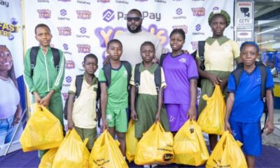 Femi Hanson (middle), Head of Marketing & Communications with some of the beneficiaries of the initiative redeeming their shopping vouchers