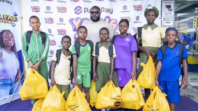Femi Hanson (middle), Head of Marketing & Communications with some of the beneficiaries of the initiative redeeming their shopping vouchers